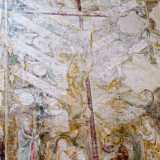 Al centro, seppur molto sbiadito, si staglia imponente il Cristo sulla croce, dal quale dipartono dodici rami accompagnati da scritte ormai quasi illeggibili. Ai piedi del Messia vi sono la Vergine e San Giovanni, con al centro San Pietro e Paolo racchiusi in due grandi foglie